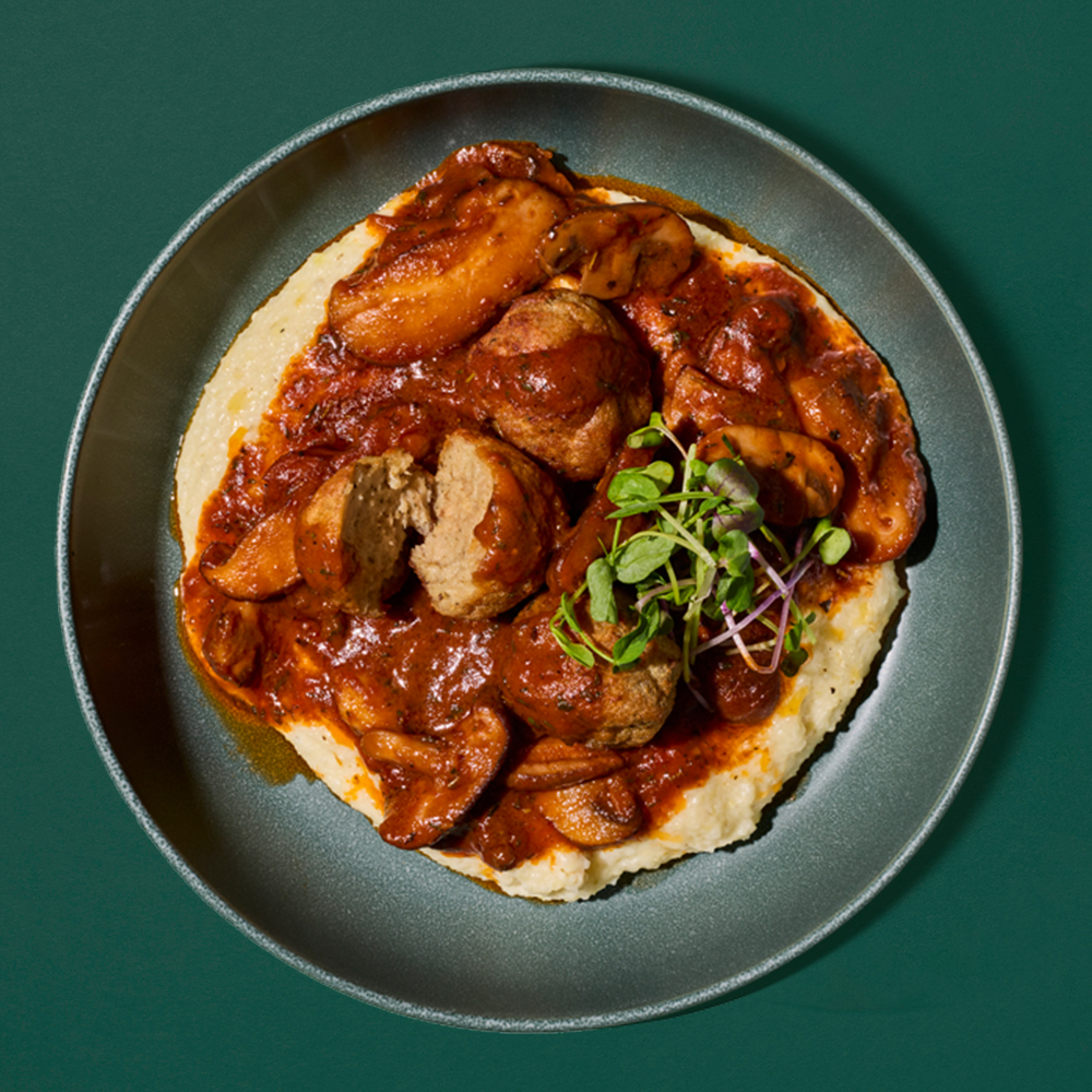 PLANT-BASED MEATBALLS OVER MUSHROOMS AND GRITS